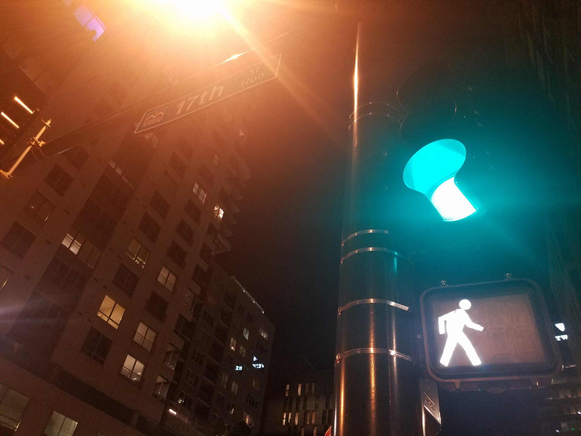 Blurry Walk Symbol and Traffic Light, Downtown Denver at Night.